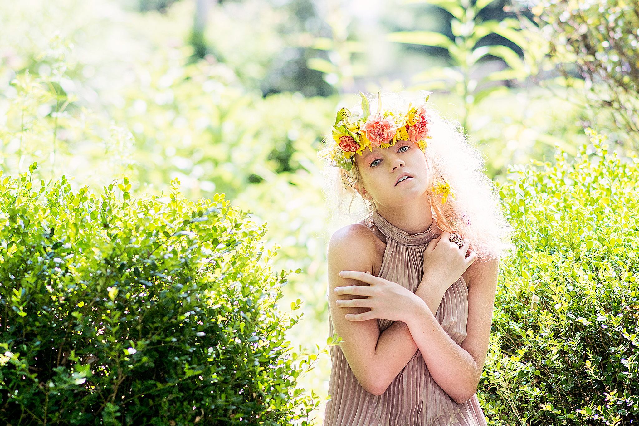 Girl backlit wearing flower crown by Louisville Fashion Photographer