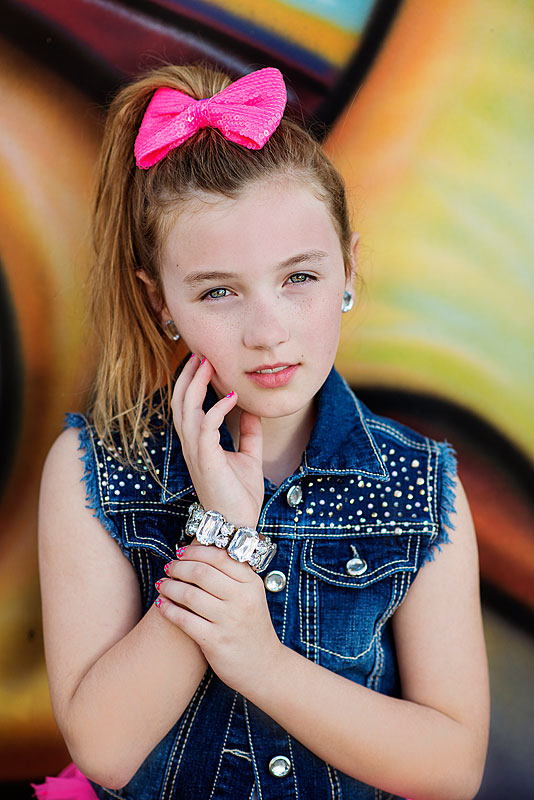 Lexington child portrait of tween wearing pink bow.