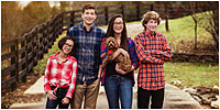 Family pictures of kids and dog in the fall by Louisville Family Portrait Photographer