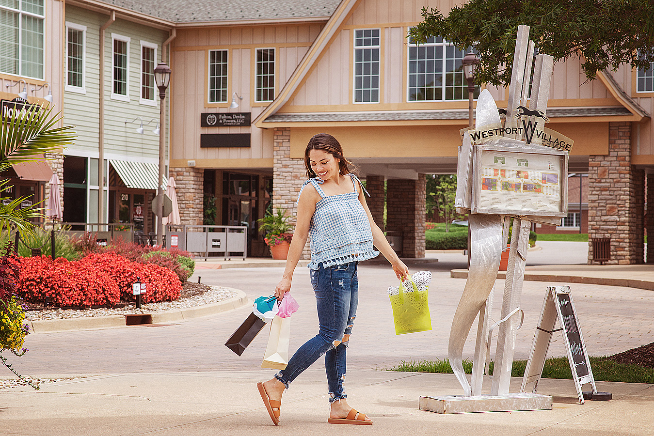 Woman with shopping bags in Westport Village for commercial photography and branding