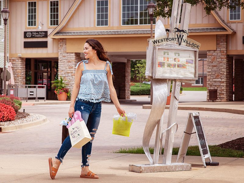 Westport Village Shopping Center with Girl with bags by Branding Photographer