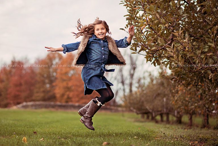 Girl jumping celebrating 10th bday photo ideas with Louisville Tween Photographer