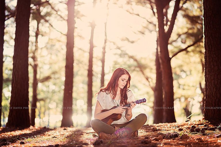 Red Head Girl playing ukulele in woods for Louisville Senior Pictures Ray Davis