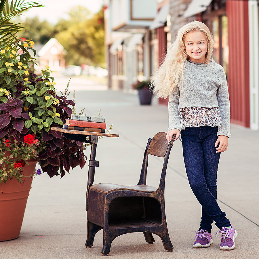 Tween girl standing by desk during Louisville Tween Photographers Back to School Mini Session Event