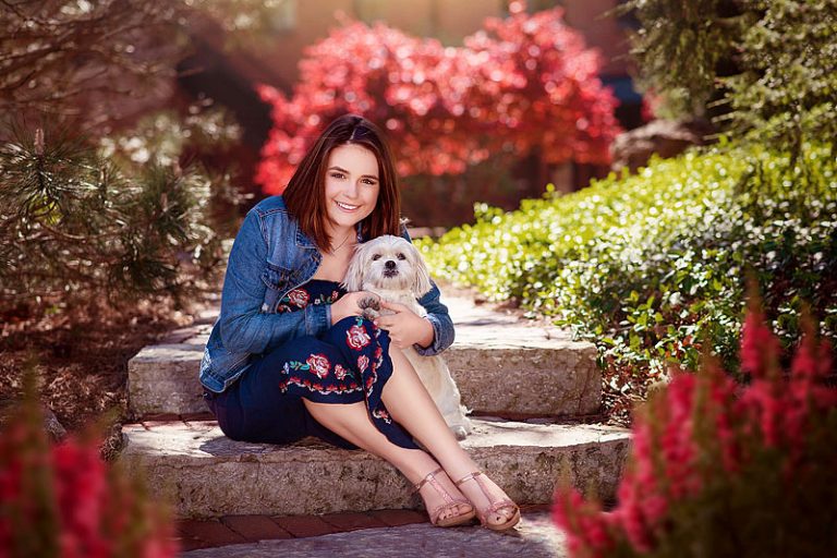 Girl sitting on steps with dog for spring senior pictures by Ray Davis Photography