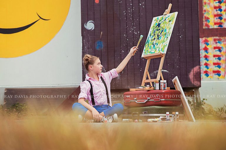 child artist little girl painting on canvas as painter during shoot with Louisville tween Photographer Ray Davis Photography