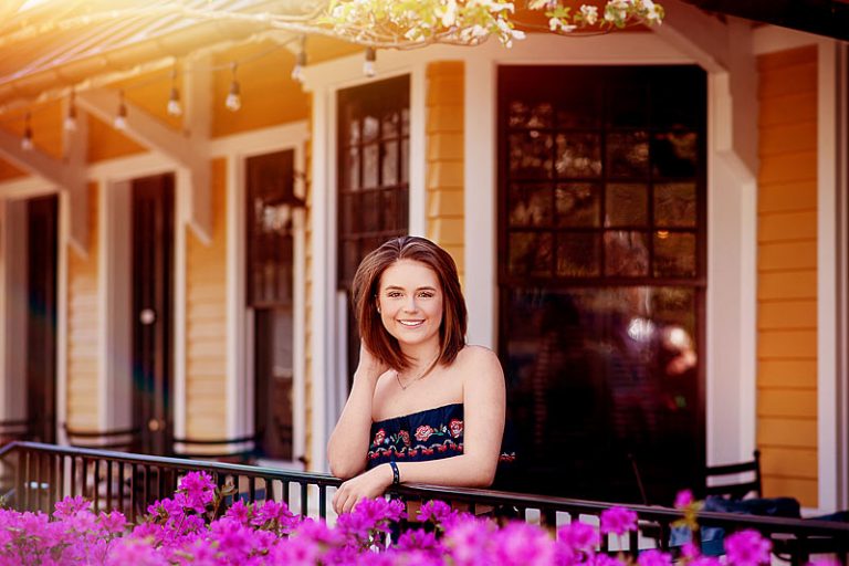 Girl leaning on railing at The Village Anchor om Amchorage KY for Louisville Senior Pictures