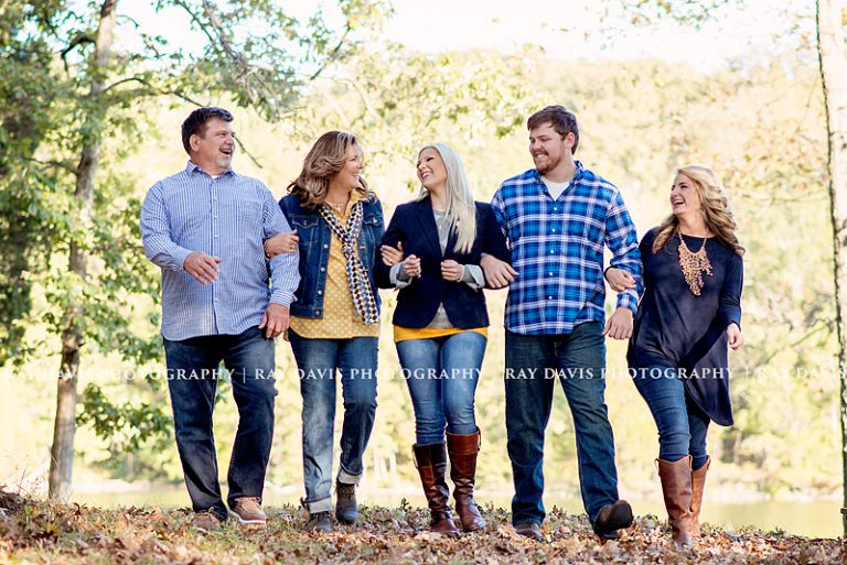 older family walking by lake arm in arm by Louisville family photographer