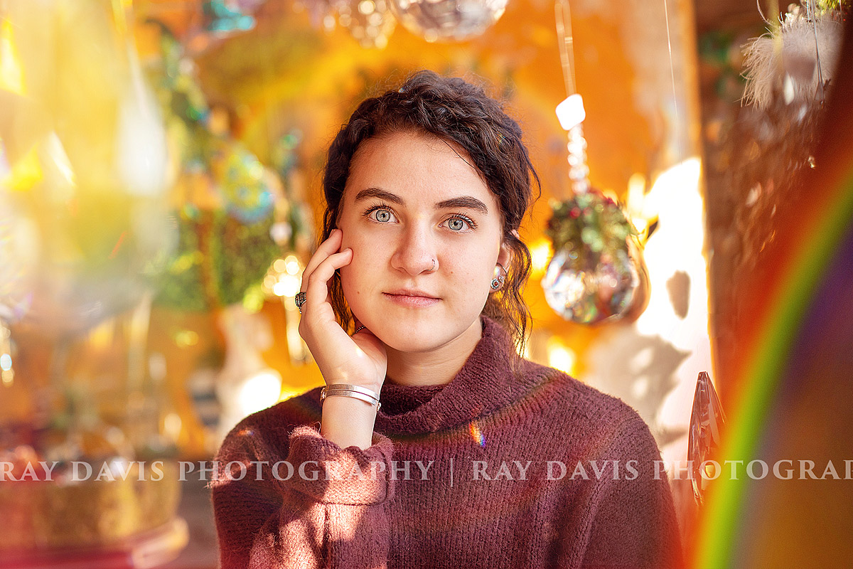 Louisville Senior Photographer captures this rainbow shot of senior inside of Red Tree Nulu