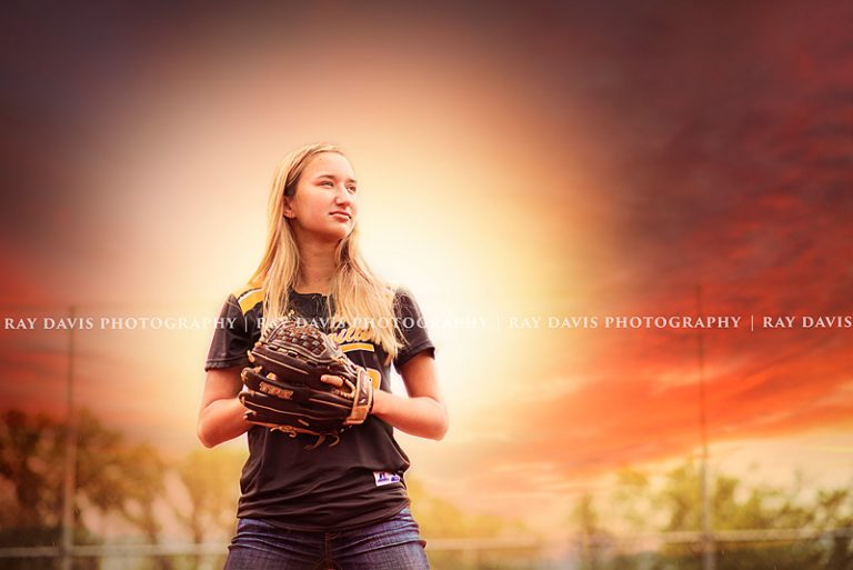 Louisville softball player with mitt taken by Senior Photographer Ray Davis