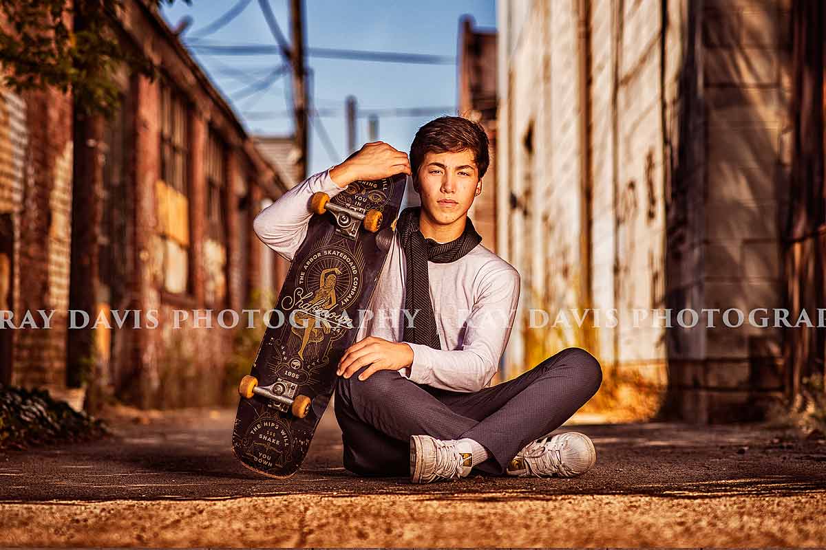 Louisville Urban senior guys picture posing with skateboard by Ray Davis Photography