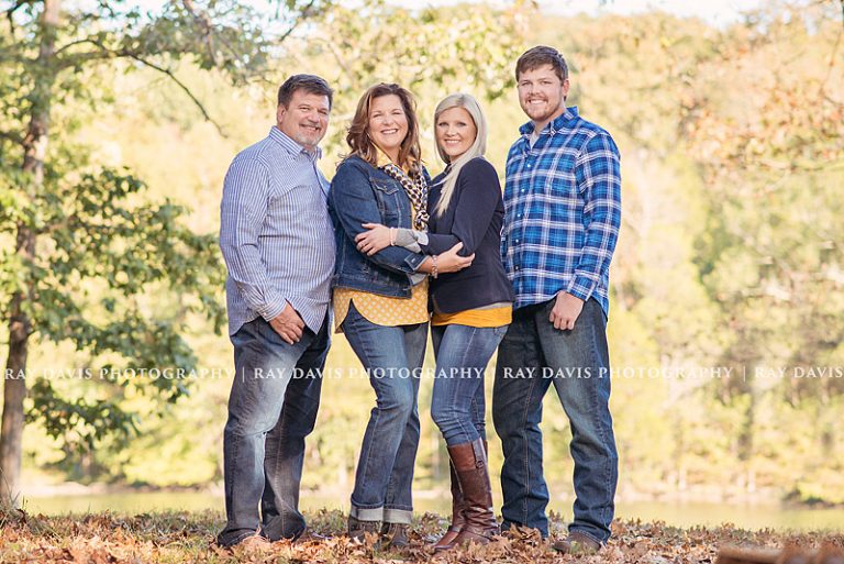 Mature family portrait on edge of lake by Louisville Photographer