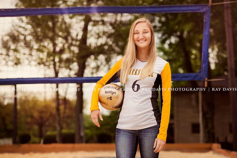 Senior girl picture in front of Volleyball Net