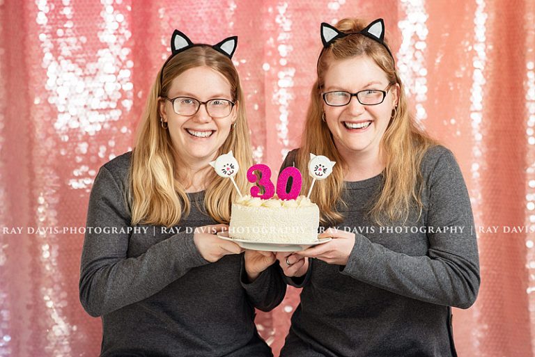 Twin 30th Bday Girls holding Cat Cake